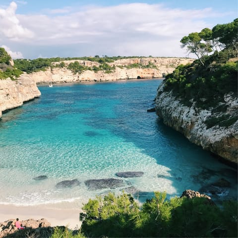 Swim in the secluded cove at Caló des Moro, a fifteen-minute drive away
