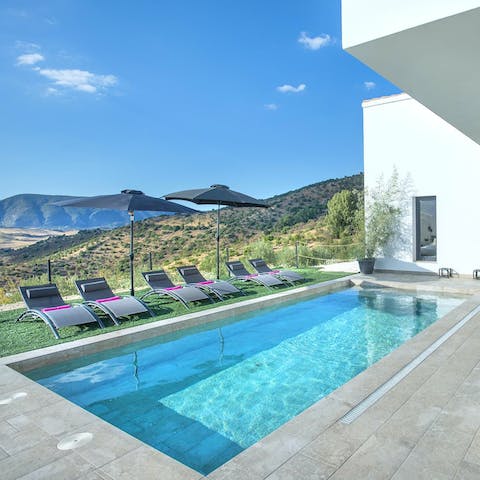 Lie back and relax on a lounger or splash about in the swimming pool