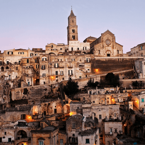 Drive into central Matera and discover the city's cave-dwelling districts
