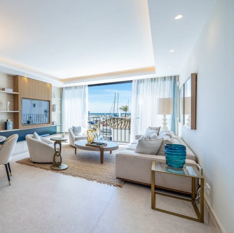 Soak up the marina views from the contemporary living room