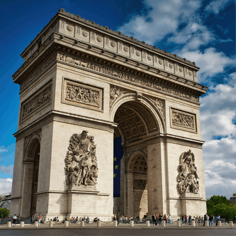 Kick off your sightseeing at the Arc de Triomphe, a short walk away