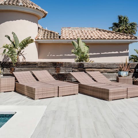 Laze on loungers in the sun on your private terrace