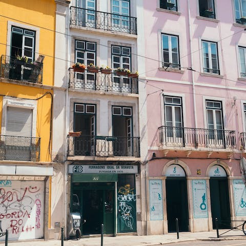 Fuel up on Pastéis de Nata and walk for twelve minutes uphill to the lively Bairro Alto neighbourhood 