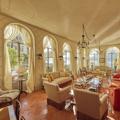 Relax in a living room as bright as an orangery – one of three grand lounges