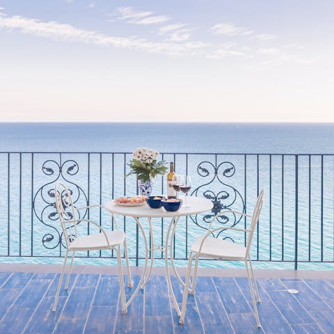 Savour a glass of wine on the terrace and admire the sweeping sea views