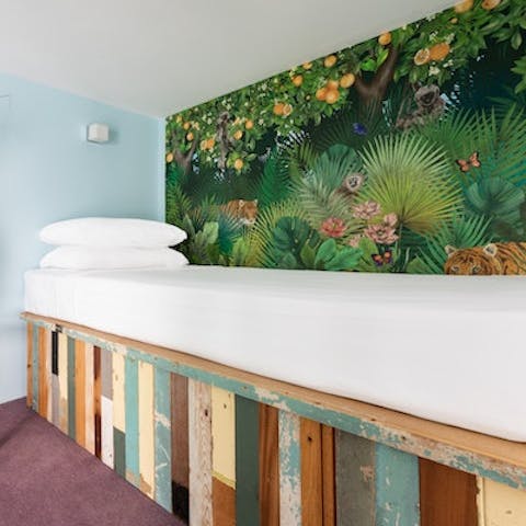 Find yourself immersed in the jungle theme in the single bedroom