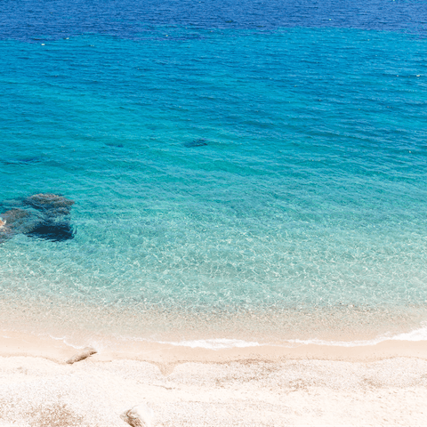 Swim in the sea at Ornos Beach – it's only a few minutes away
