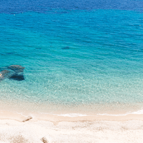 Swim in the sea at Ornos Beach – it's only a few minutes away