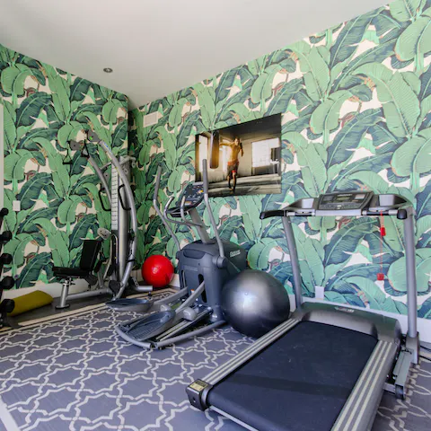 Squeeze in a workout in the home's boldly decorated gym