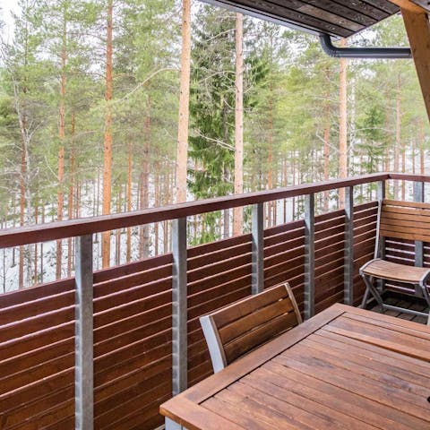 Enjoy a peaceful breakfast out on the apartment's balcony