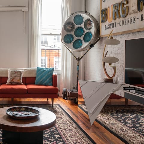 Relax and renew in the eclectic living room after a day of Brooklyn sightseeing