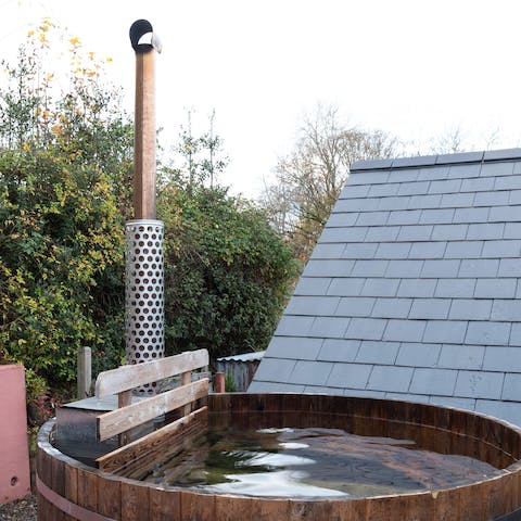 Soak under the stars in the wood-fired hot tub outside
