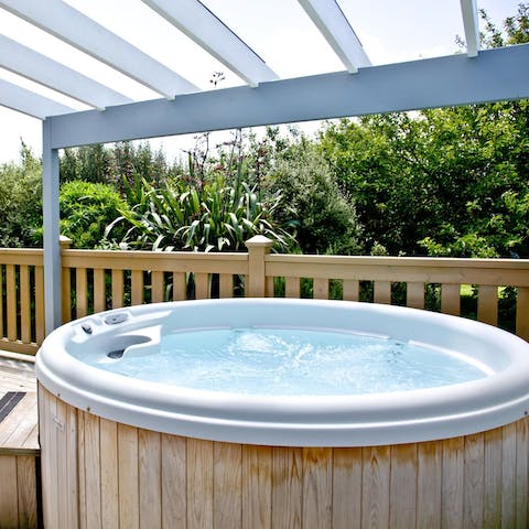 Enjoy a soak in the covered hot tub