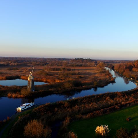 Stay in the Norfolk Broads National Park and putter along the waterways by boat