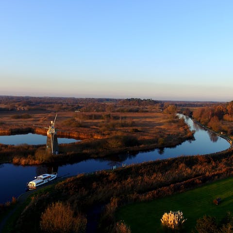Stay in the Norfolk Broads National Park and putter along the waterways by boat