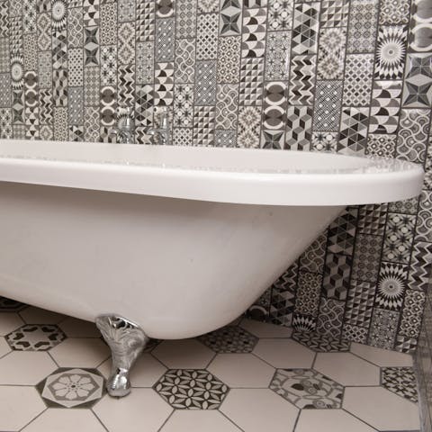 Sink into the roll-top bath for a bubbly soak