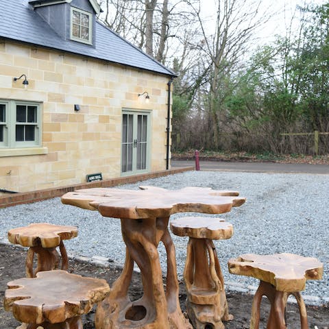 Dine alfresco on the rustic wooden table set