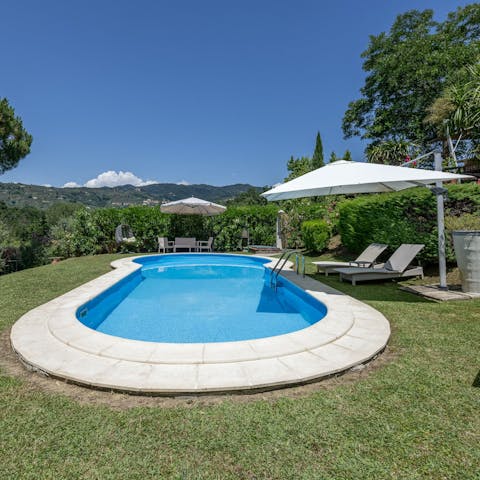 Admire views of the Tuscan hills as you cool off in the private pool