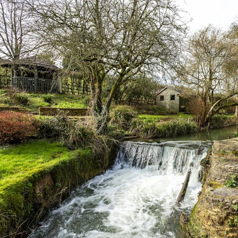 Relax in the garden as you listen to the sound of the waterfall