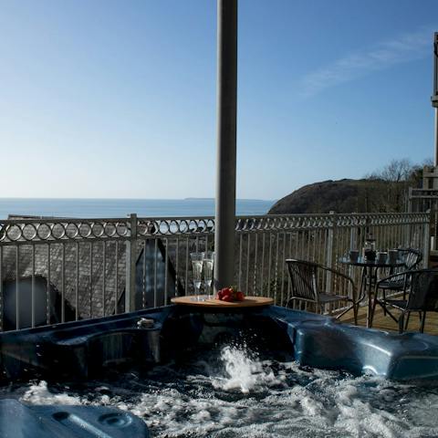 Savour the sea views as you soak in the private hot tub