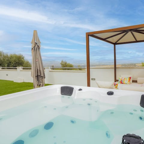 Watch the sunset from the bubbles of the hot tub