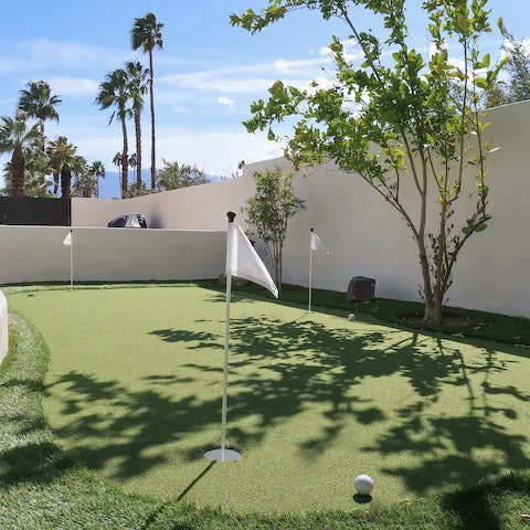 Practice your swing on the garden's three-hole putting green