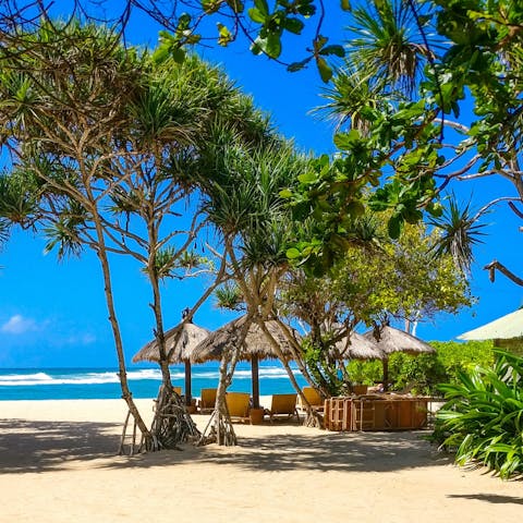 Bask on the pristine sands of Asmara Beach, under 100 metres away