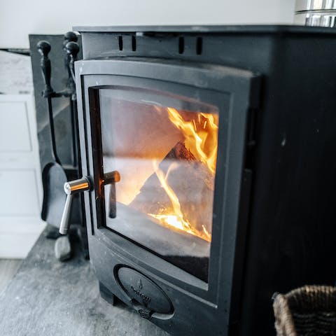 Snuggle up on the sofas by the log-burning stove 