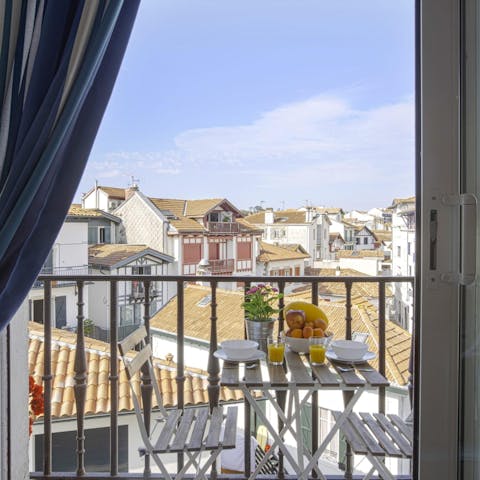 Take a seat on the private balcony and look out over the town's rooftops