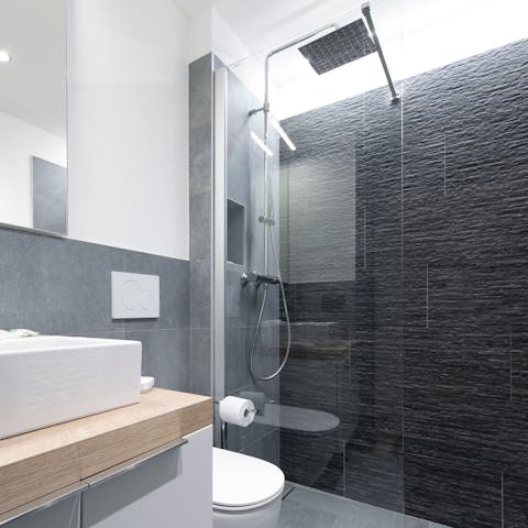 Start mornings with a luxurious soak under the bathrooms' rainfall showers