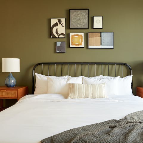 Get some rest in the stylish bedroom after a busy day in Savannah
