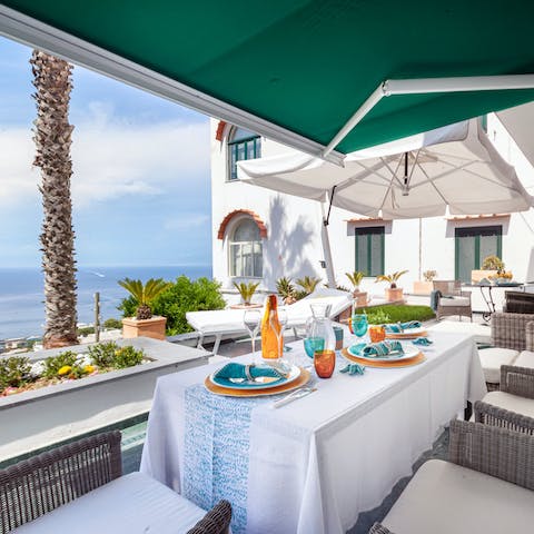 Sit out on the terrace and dig into Caprese salad with gorgeous sea views