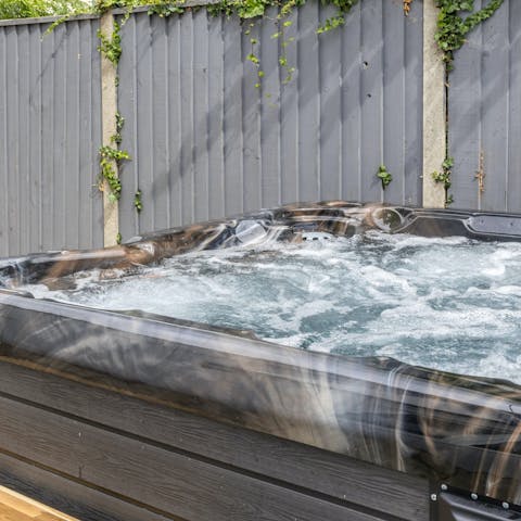 Soak in the hot tub after a wind-whipped walk along the coast