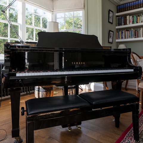 Gather guests around the grand piano by the bay window for a sing-song