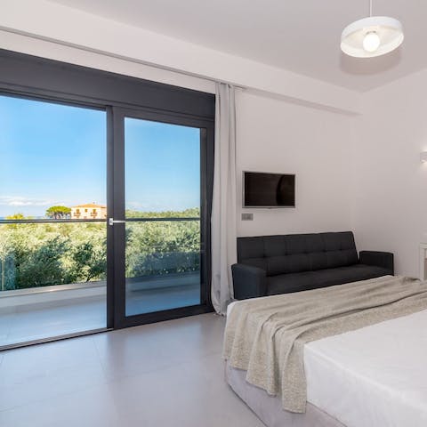 Step out onto the bedroom's balcony and gaze out over the Ionian Sea