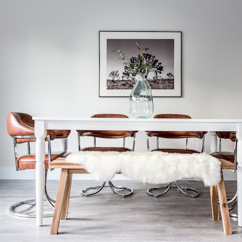 Gather the group at the stylish dining table