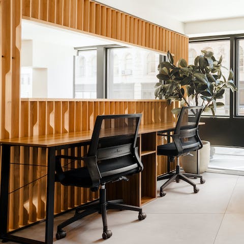 Hunker down in the on-site workspace and catch up on your emails