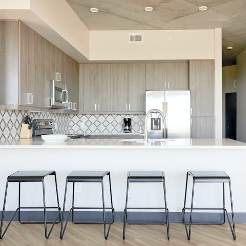 Start the day at the sleek breakfast bar in the kitchen