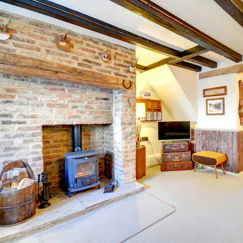 Cosy up in front of the log burner fire, after a day of exploring the local walking trails