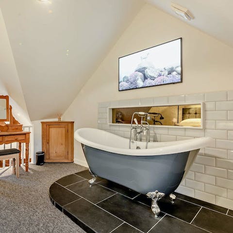 Treat yourself to a relaxing soak in the roll-top bathtub