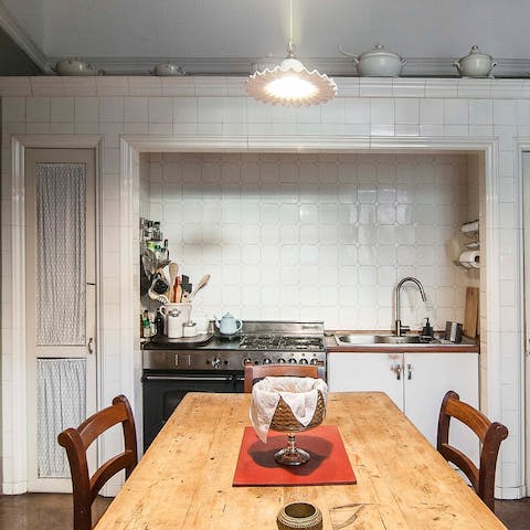 Knock up a hearty meal in the white tiled kitchen
