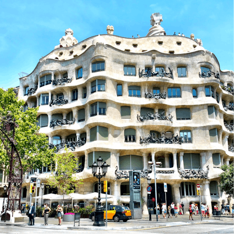 Admire the fascinating architecture of Casa Mila – it's only a metro ride away