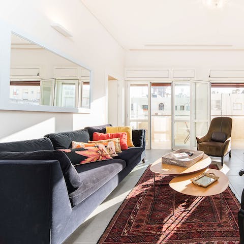 Make yourself comfortable in the bright living area after a busy day exploring Tel Aviv