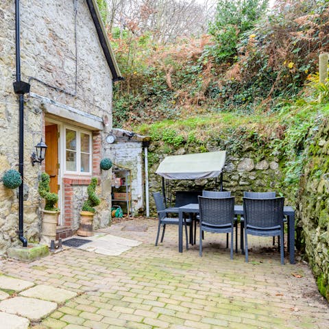 Start the day with breakfast out on the cottage's patio