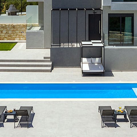 Relax and unwind by the luxurious swimming pool 