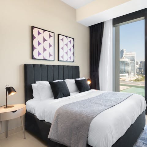 Relax and unwind on your luxurious bed with scenic views overlooking the marina