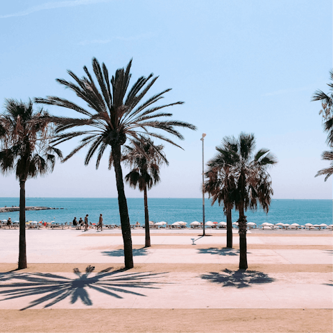 Hop in a taxi and take a fifteen minute trip to Barceloneta Beach