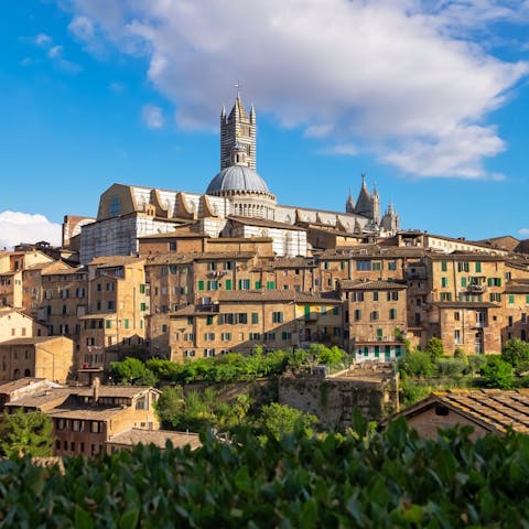 Take a day trip to Siena – this gorgeous walled city is only a thirty-four minute drive away