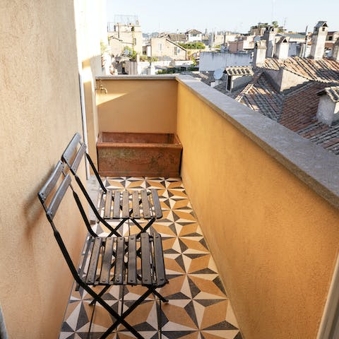 Sit on the cosy terrace and look out over the rooftops of Rome