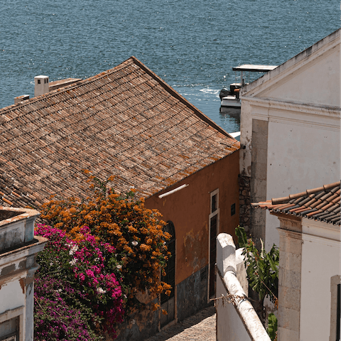 Wander the pretty streets of Faro – just a fifteen-minute drive away